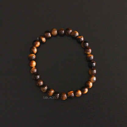 Tiger's Eye Crystal 6mm Beads Bracelet on black backgorund